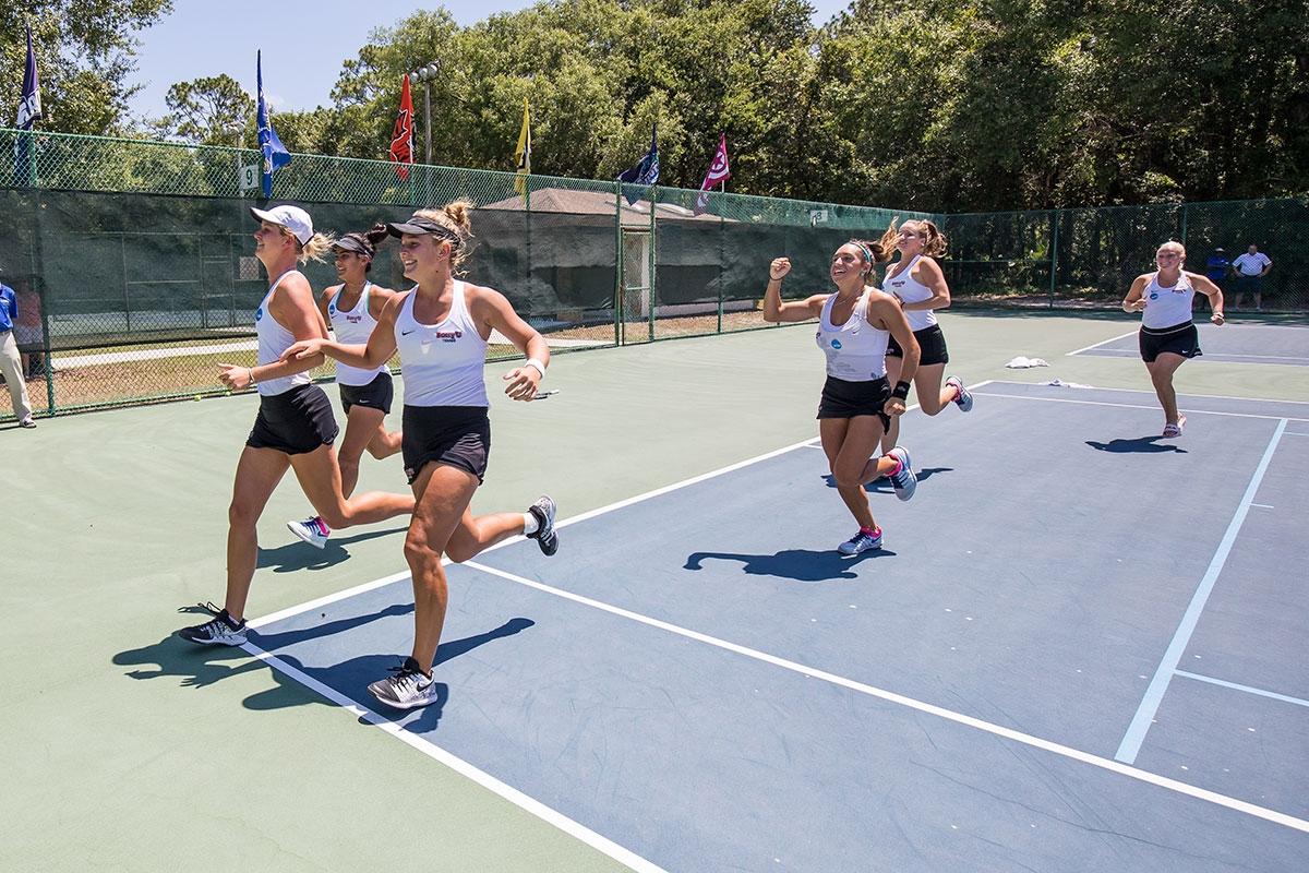 Barry celebrates the 2019 DII women's tennis title.